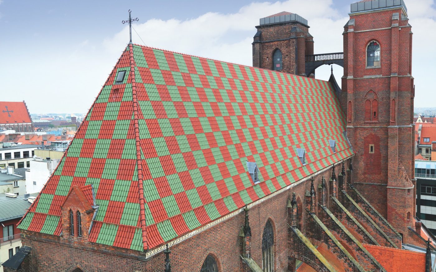 St Magdalene church Wroclaw Poland with monk nun roof tile