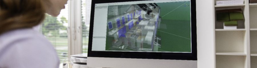 Female project manager at office desk working with BIM