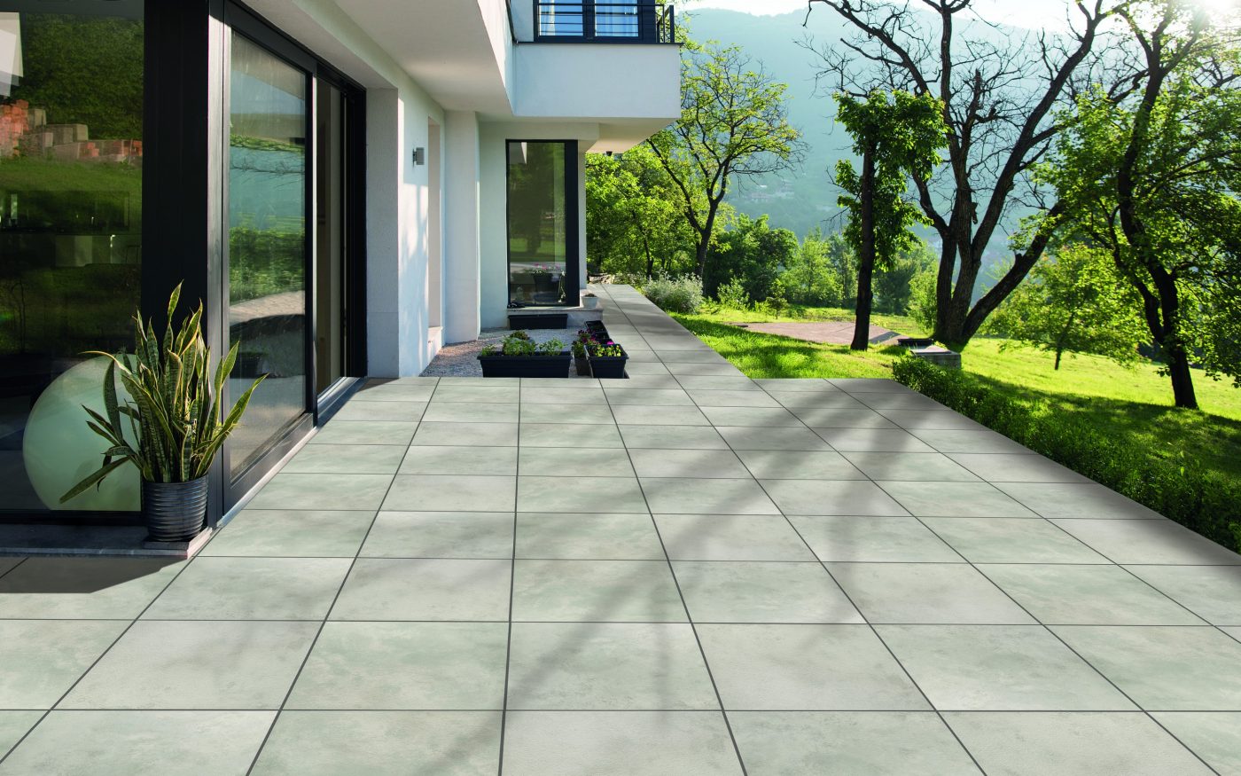 portrait of a young beautiful successful woman in the doorway of her luxury home villa