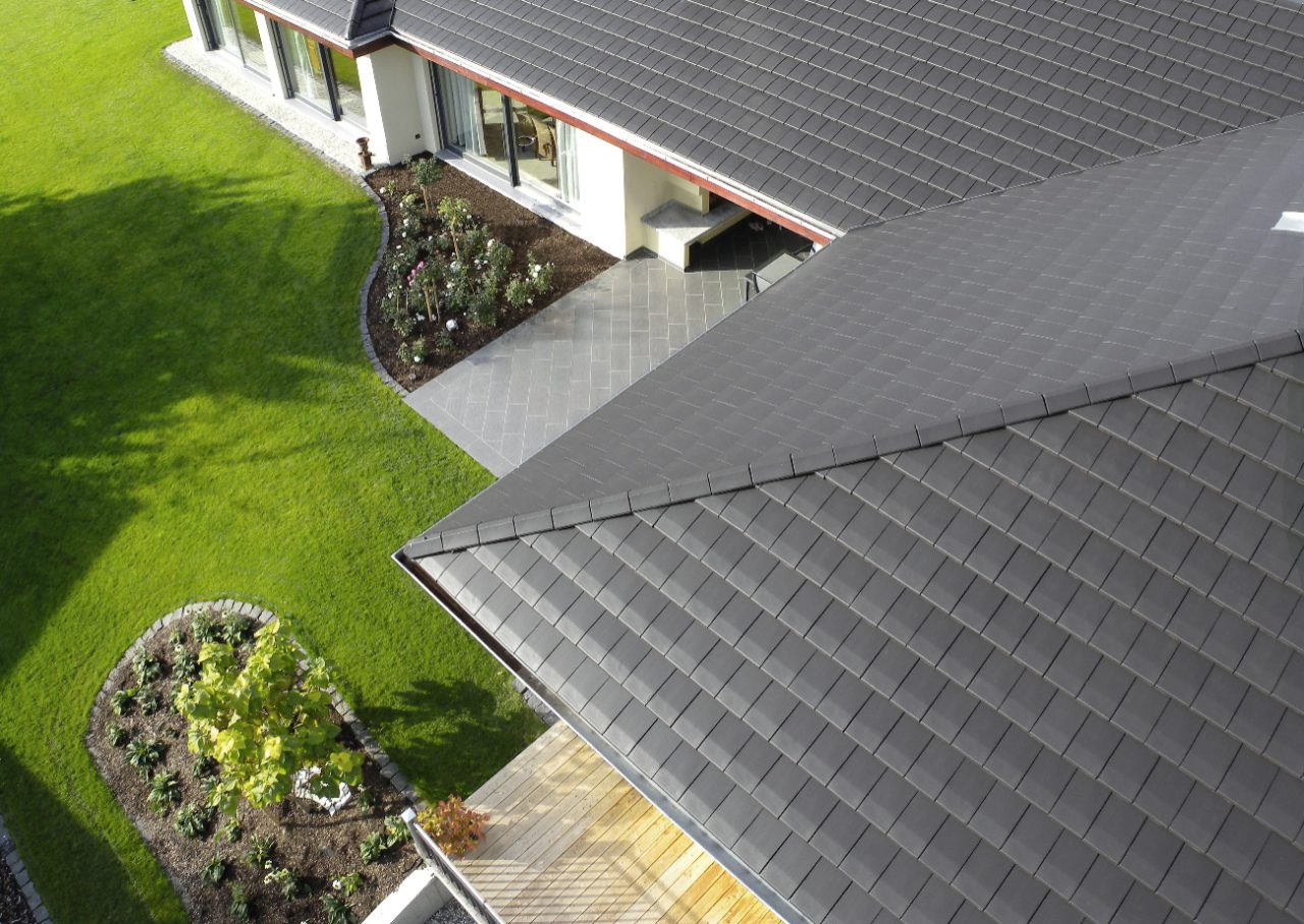 close up flat roof tiles noble graphite, aerial view