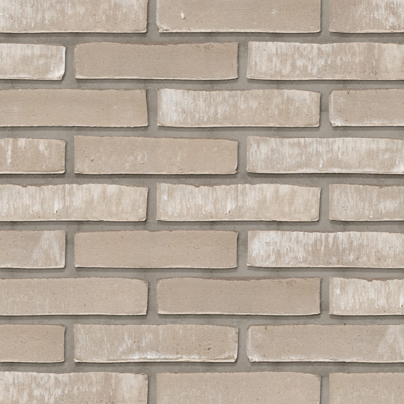 Tekstura cegieł i płytek klinkierowych Terca Misto. Lico jest strukturyzowane wodą, a kolorystyka utrzymana w odcieniach szaro-beżowych.