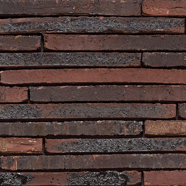 Tekstura cegieł i płytek klinkierowych Terca Long John Rusty. Produkt o nietypowym długim formacie. Lico jest strukturyzowane wodą (wasserstrich) w kolorze rdzawym.