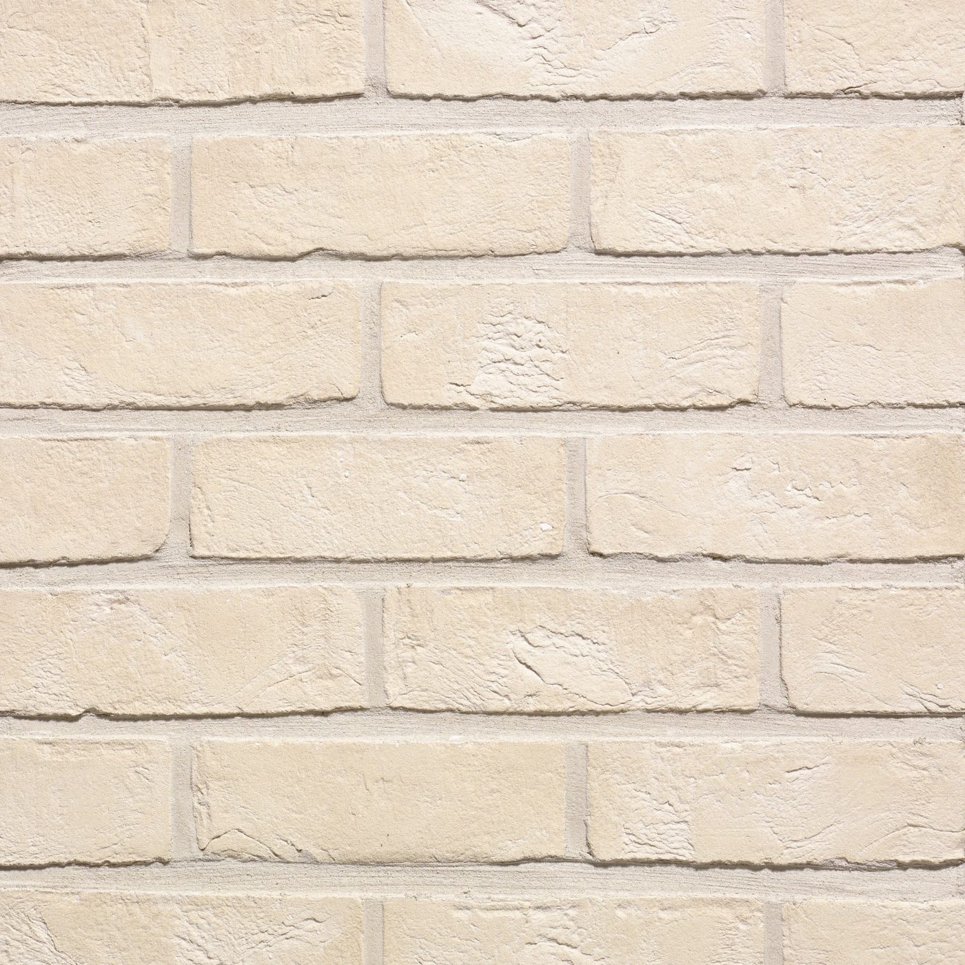 Tekstura cegieł i płytek klinkierowych Terca Superwit. Jest to powierzchnia ręcznie formowana w jednolitym kolorze białym.